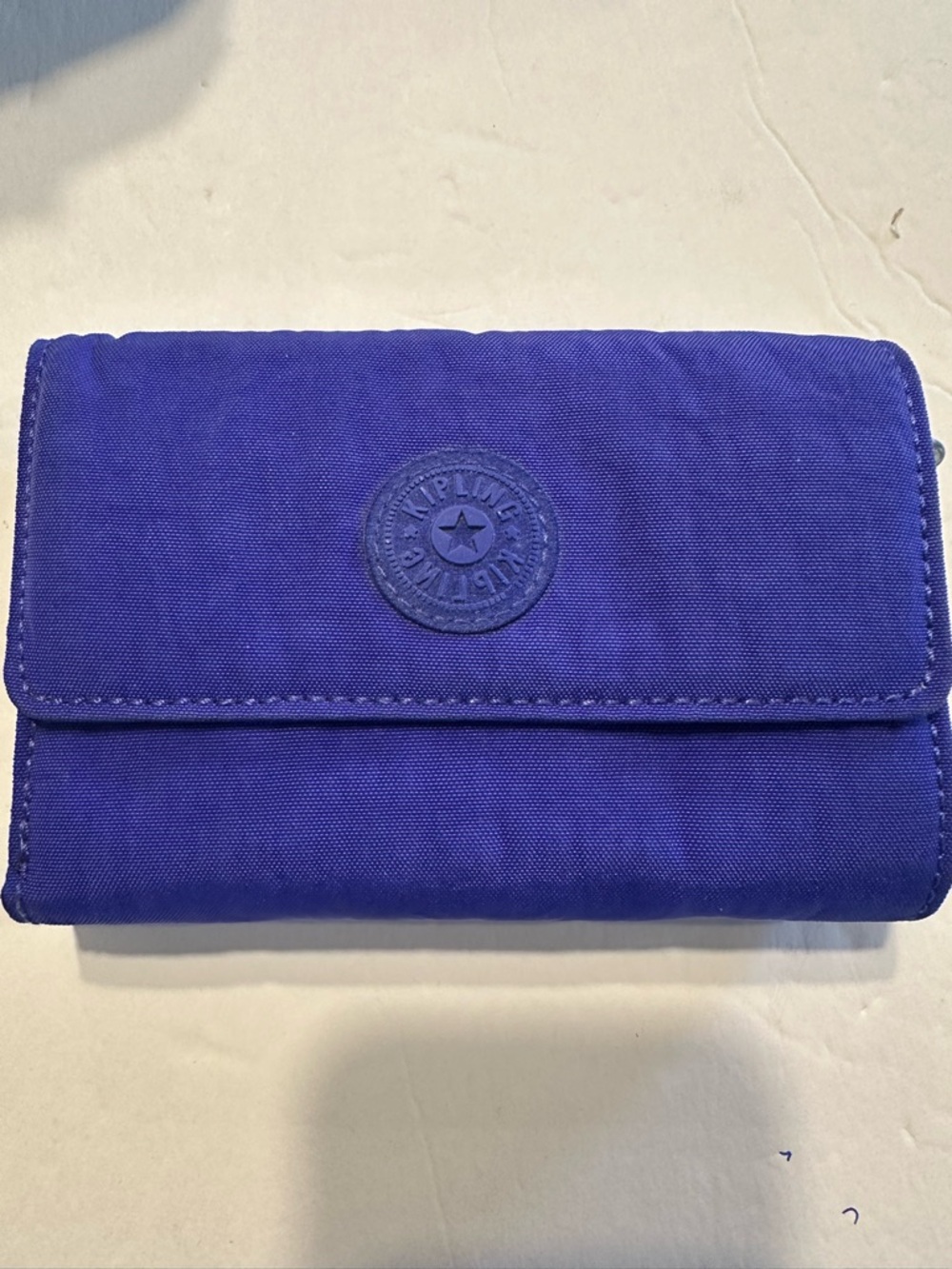 Kipling like new, retired striking purple wallet.